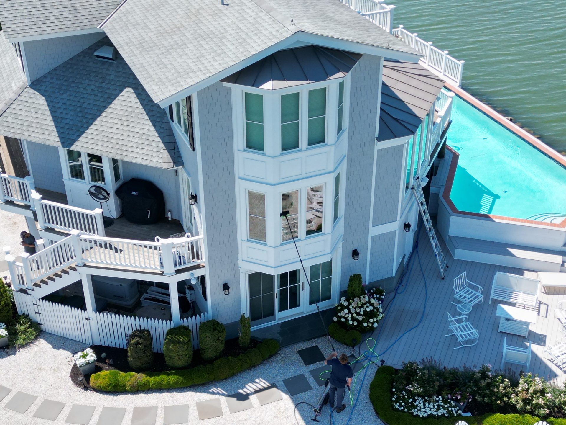 Coastal Shine cleaning the windows of a waterfront home on Maryland's Eastern Shore