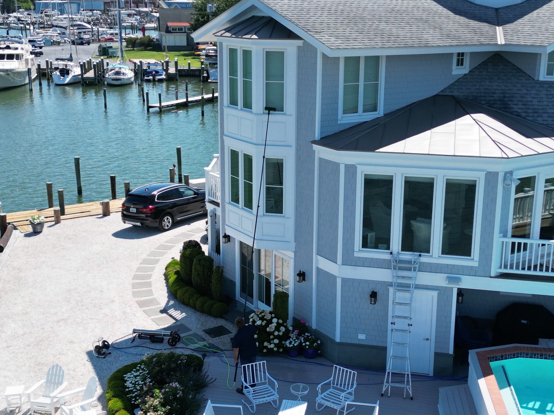 Coastal Shine cleaning the windows of a waterfront home on Maryland's Eastern Shore
