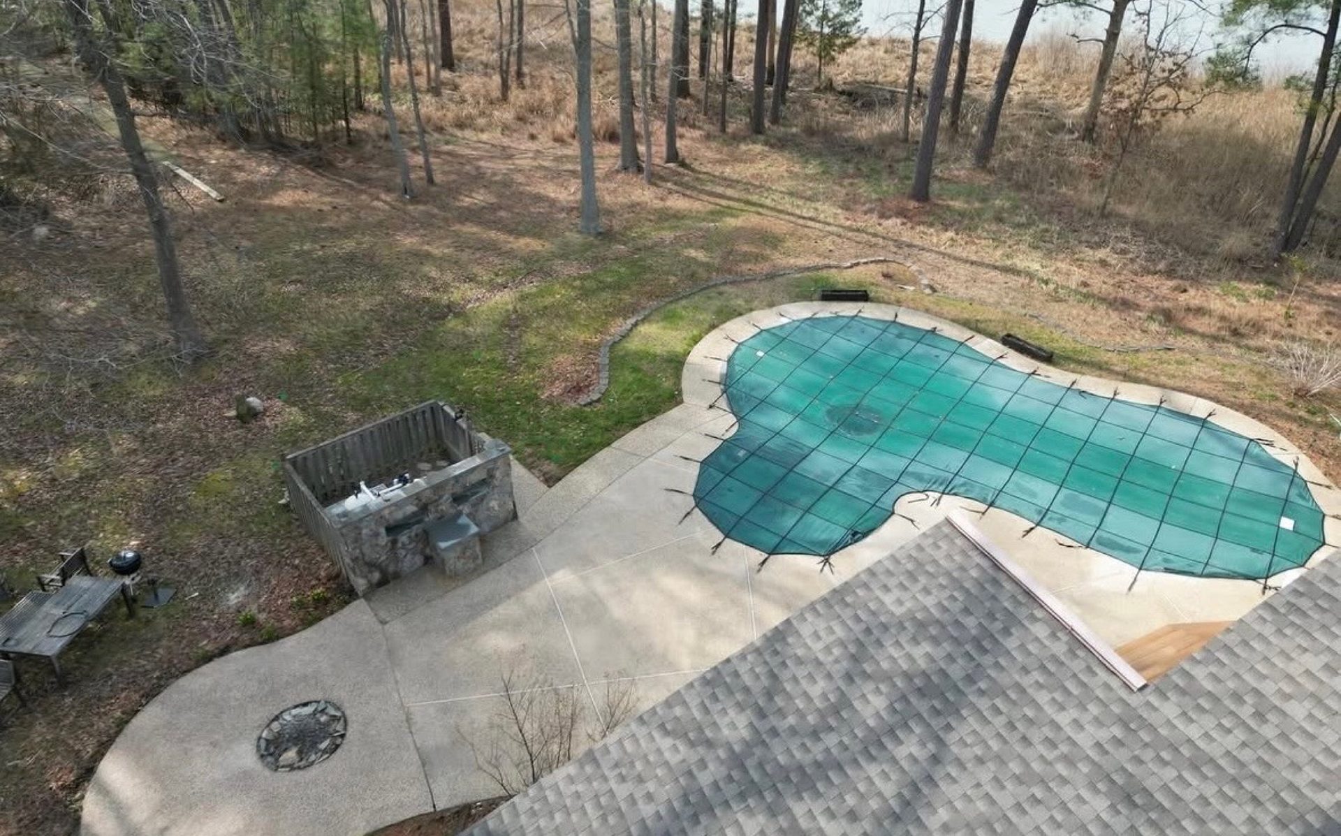 Aerial drone view of a clean pool deck and concrete patio at an Eastern Shore home near Easton MD