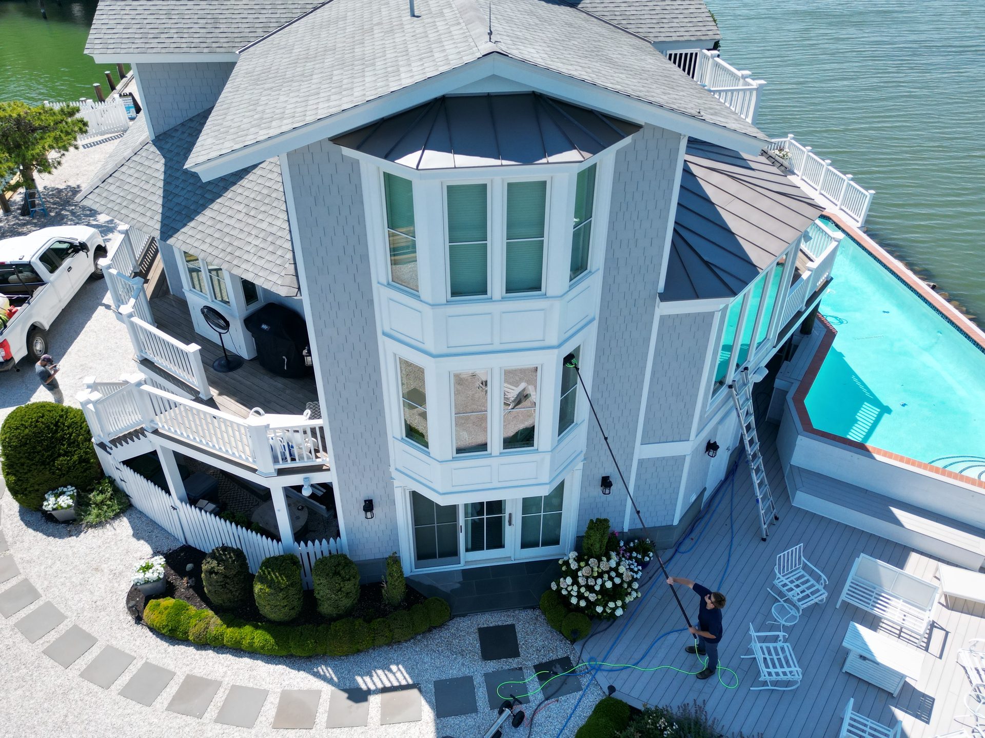 Coastal Shine cleaning the windows of a waterfront home on Maryland's Eastern Shore